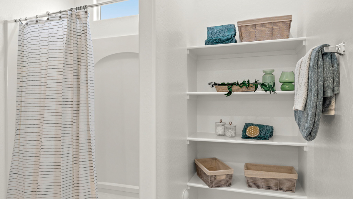 primary bathroom with dual vanities