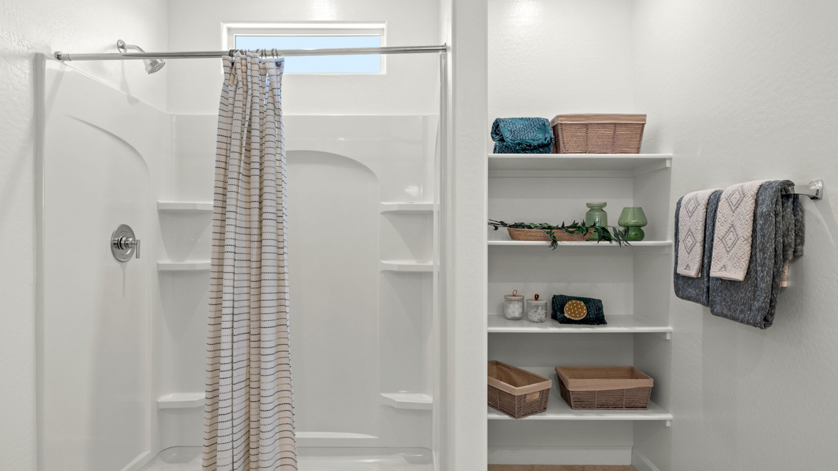 primary bathroom with dual vanities