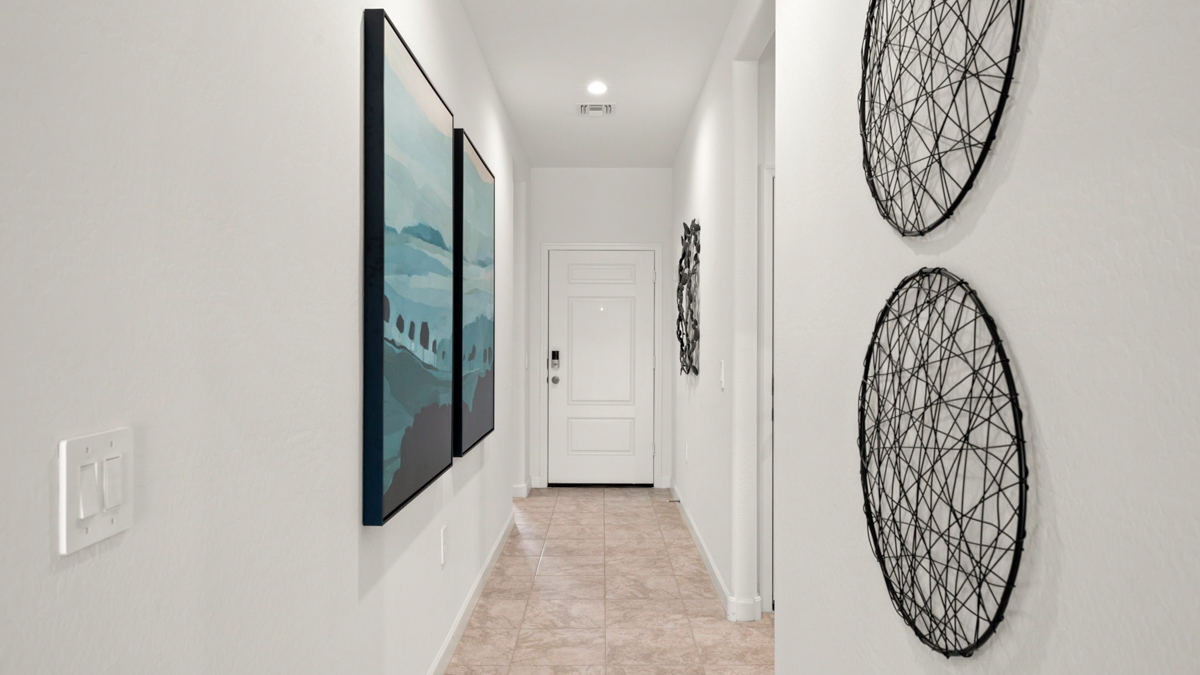 Entry hallways with front door in the background.