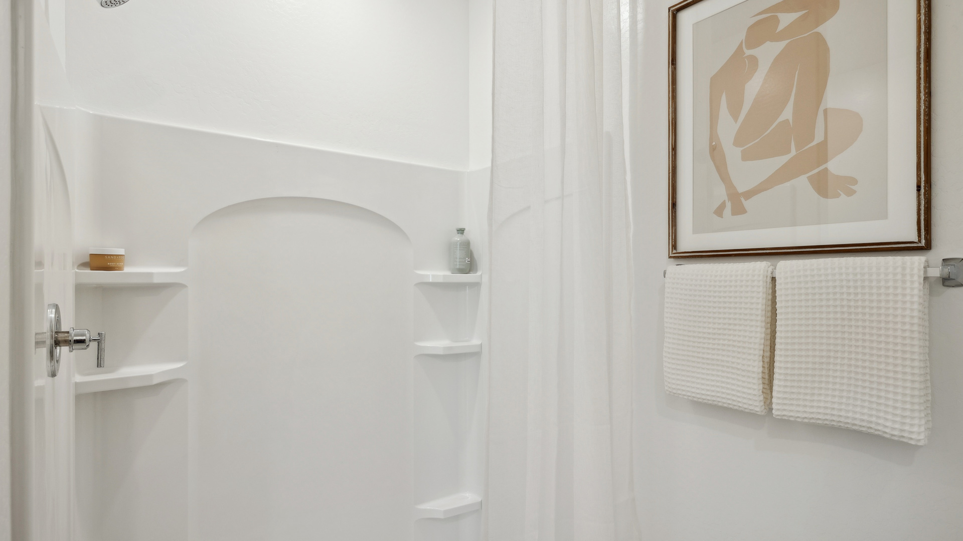 primary bathroom with dual vanities