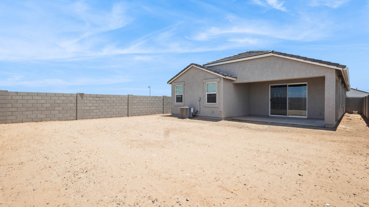 Large fenced-in backyard with a covered patio, perfect for outdoor entertaining. Large fenced-in backyard with a covered patio, perfect for outdoor entertaining.