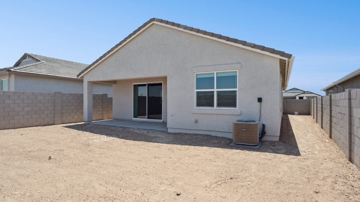 Large fenced-in backyard with a covered patio, perfect for outdoor entertainment.
