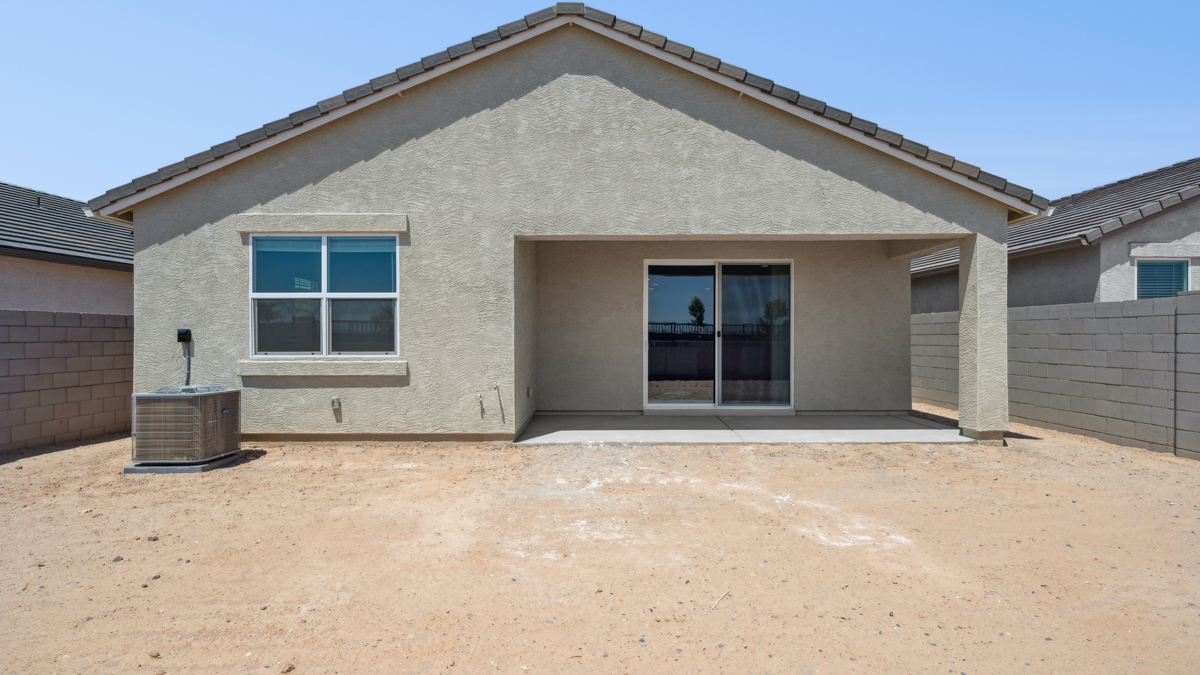 Large fenced-in backyard with a covered patio, perfect for outdoor entertaining.
