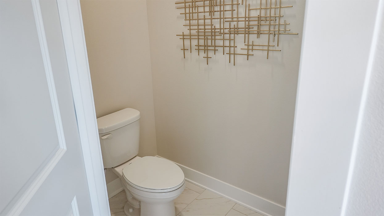 Spacious bathroom with white cabinetry and double sinks