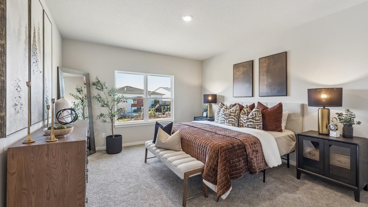 reagan primary bedroom with white bed and large window