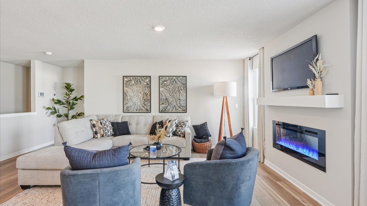 living room with electric fireplace and mounted tv