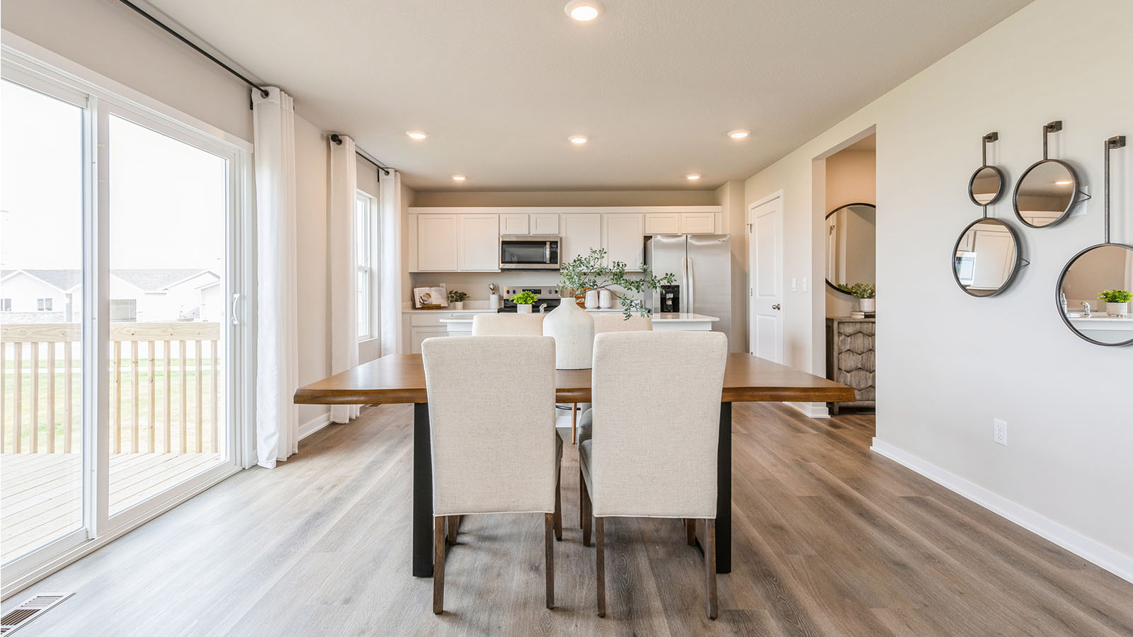 Open concept dining space with access to backyard
