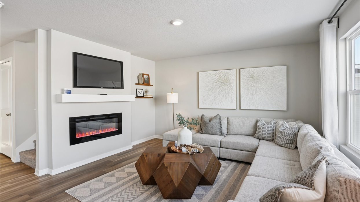 bellhaven living room with couches and mounted tv
