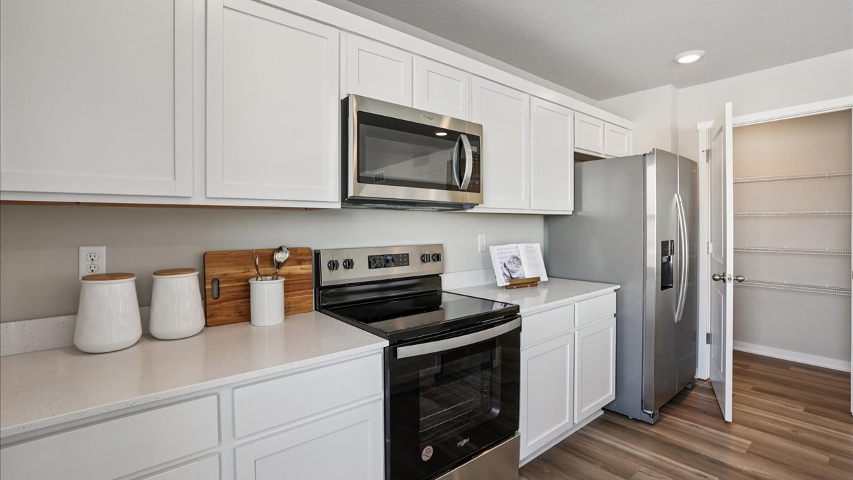 white kitchen with stainless-steel appliances