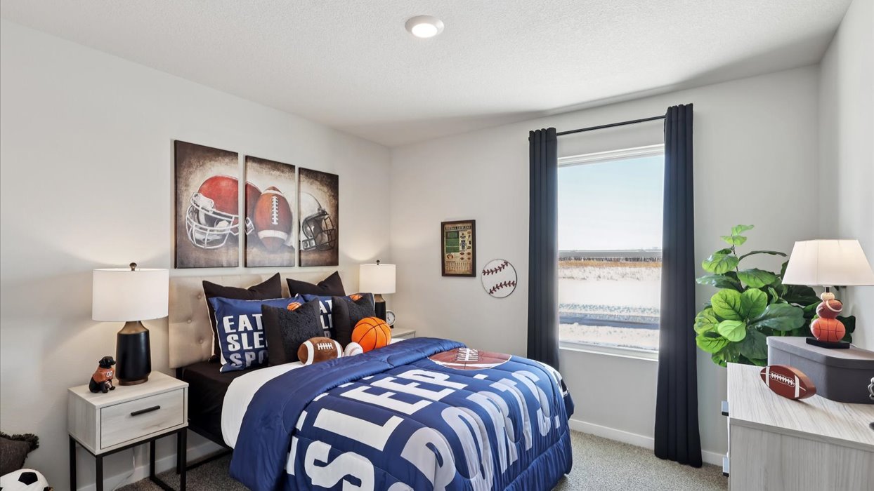 second bedroom with small window and twin bed