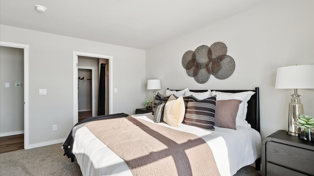 primary bedroom with bed and view of bathroom