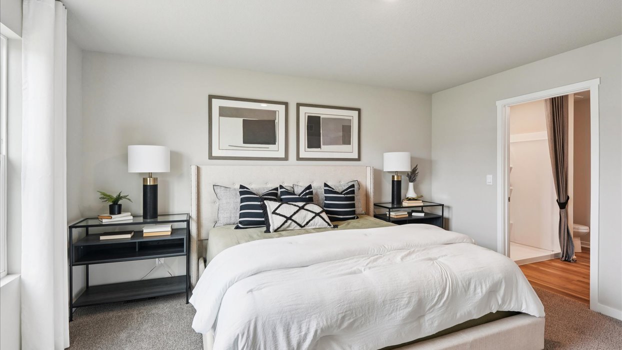 Primary bedroom with natural lighting and spacious layout