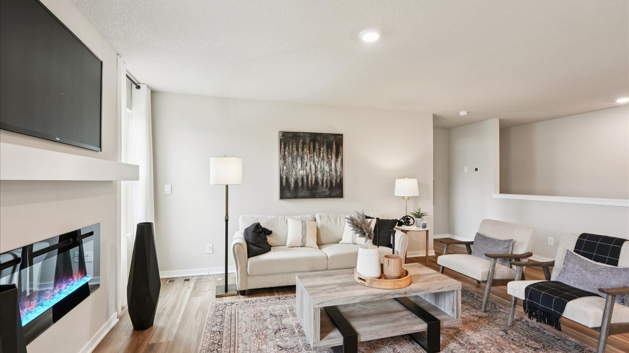 Open concept living room with electric fireplace