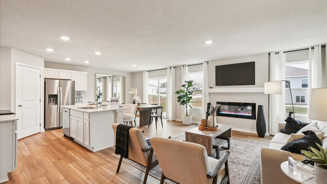Open concept living room with electric fireplace