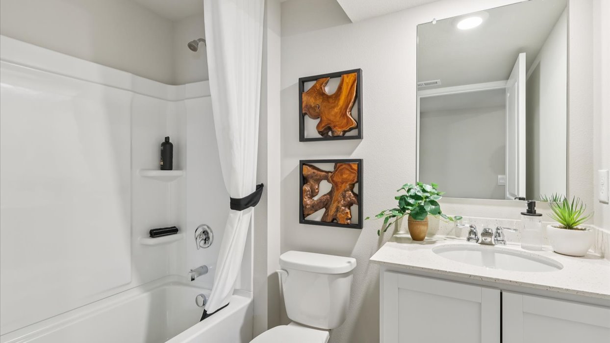 second bathroom in basement with shower and tub