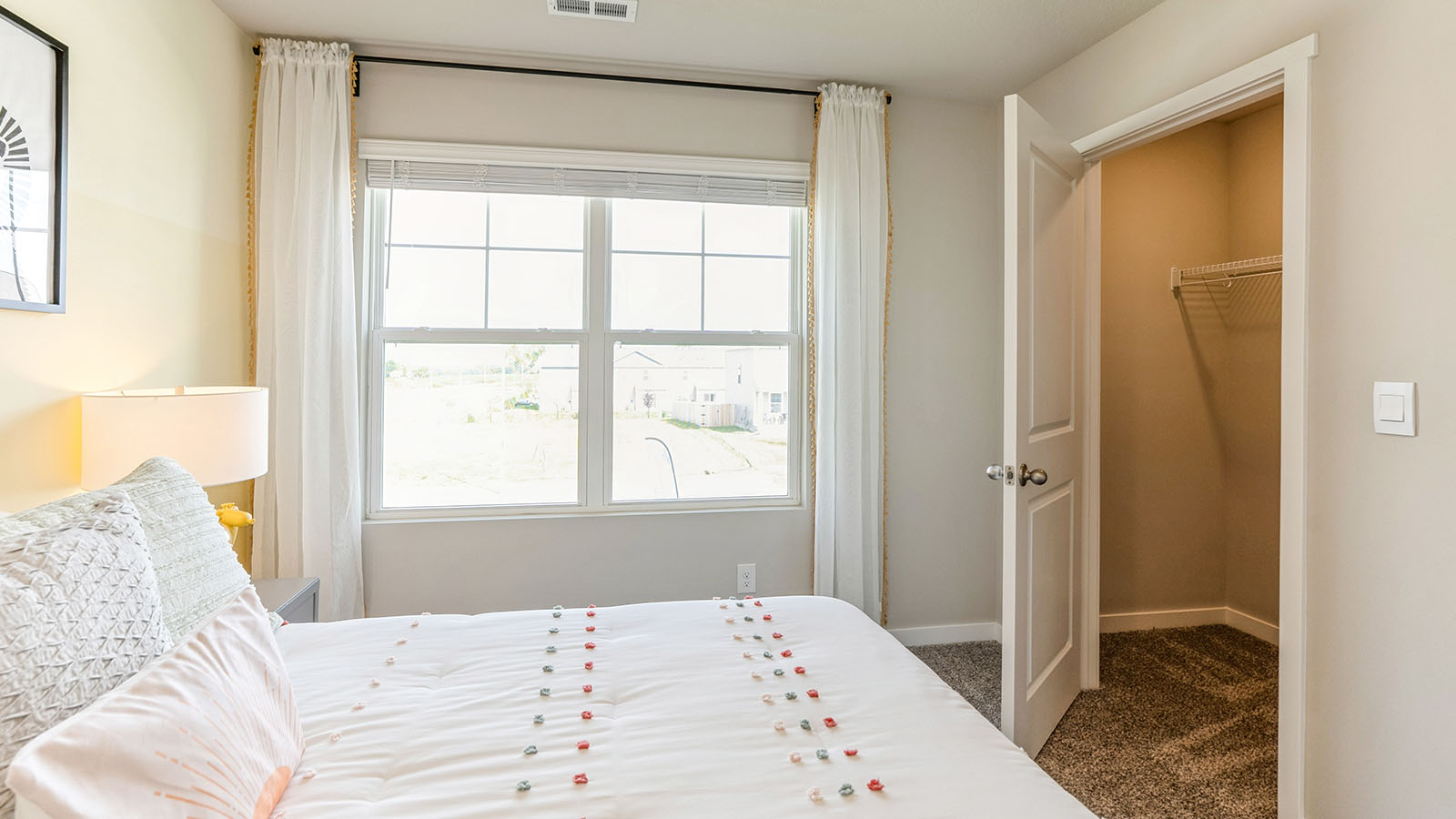 Comfortable secondary bedroom with natural light, modern finishes, and versatile living space.