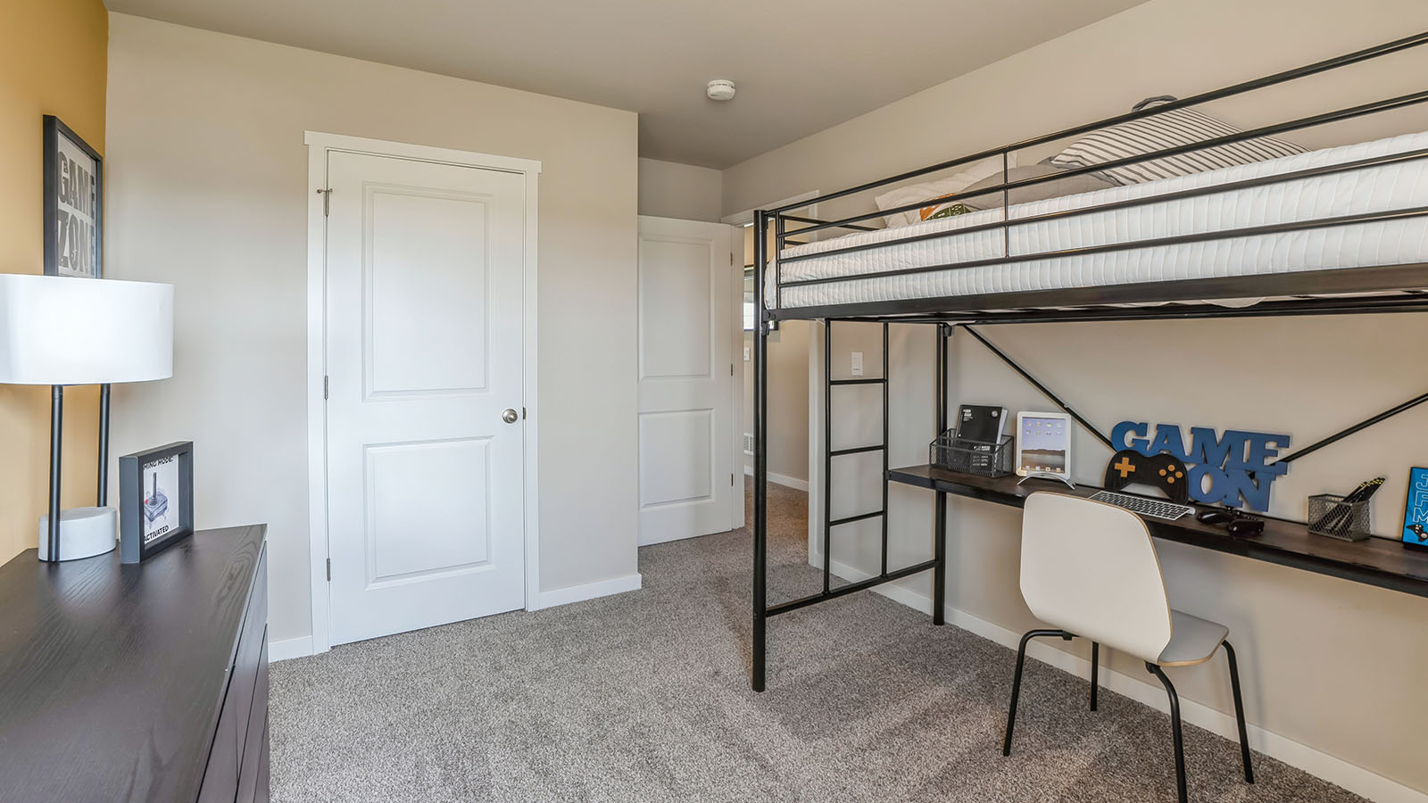 Comfortable secondary bedroom with natural light, modern finishes, and versatile living space.
