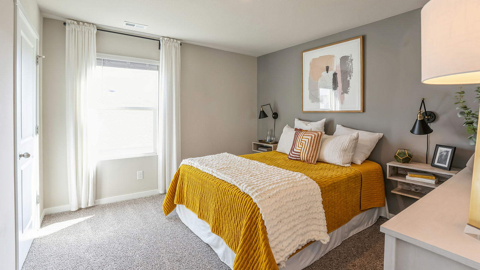 Comfortable secondary bedroom with natural light, modern finishes, and versatile living space.