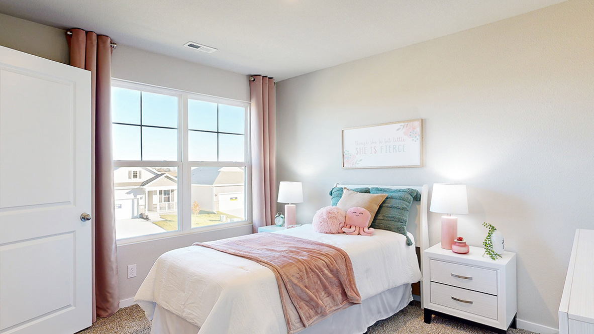 Comfortable secondary bedroom with natural light, modern finishes, and versatile living space.