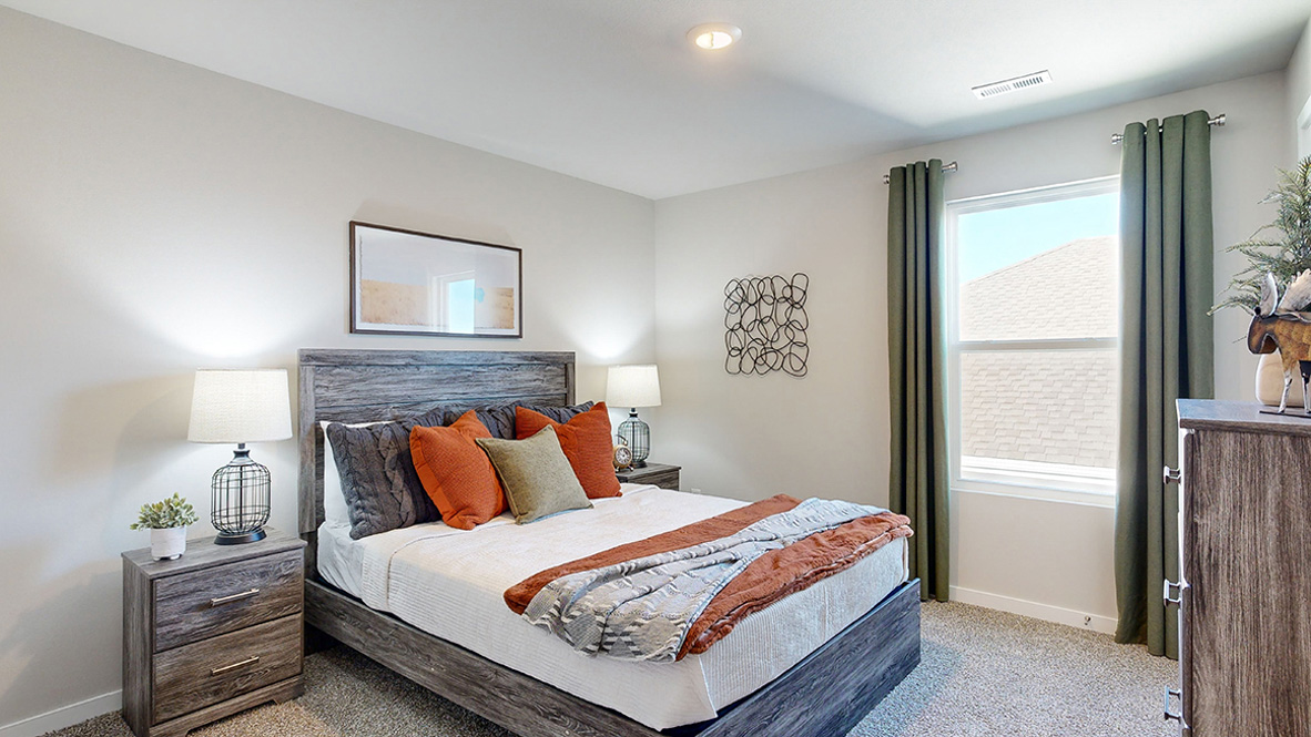 Comfortable secondary bedroom with natural light, modern finishes, and versatile living space.