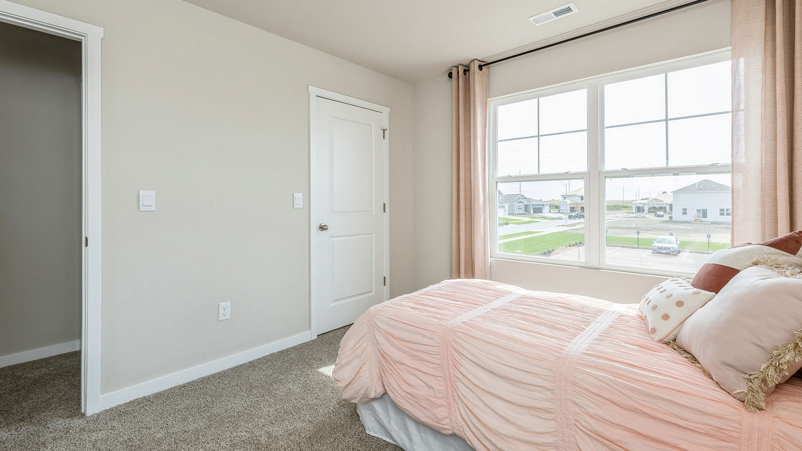 Comfortable secondary bedroom with natural light, modern finishes, and versatile living space.