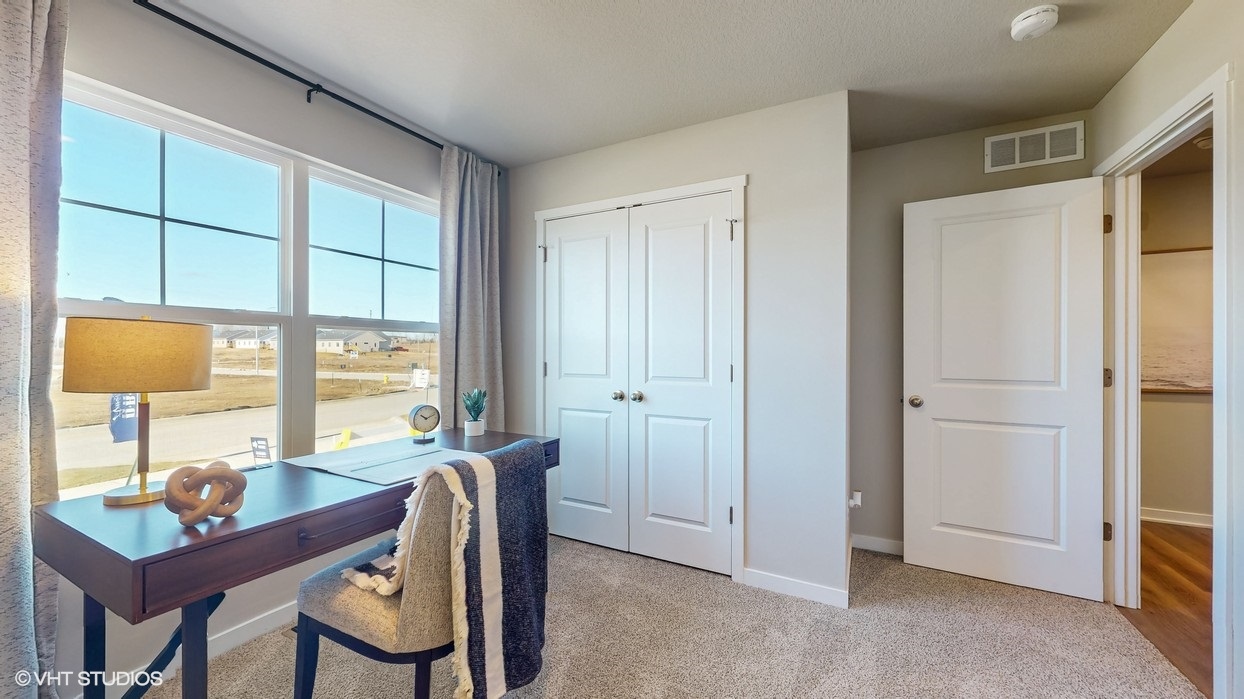 Comfortable secondary bedroom with natural light, modern finishes, and versatile living space.