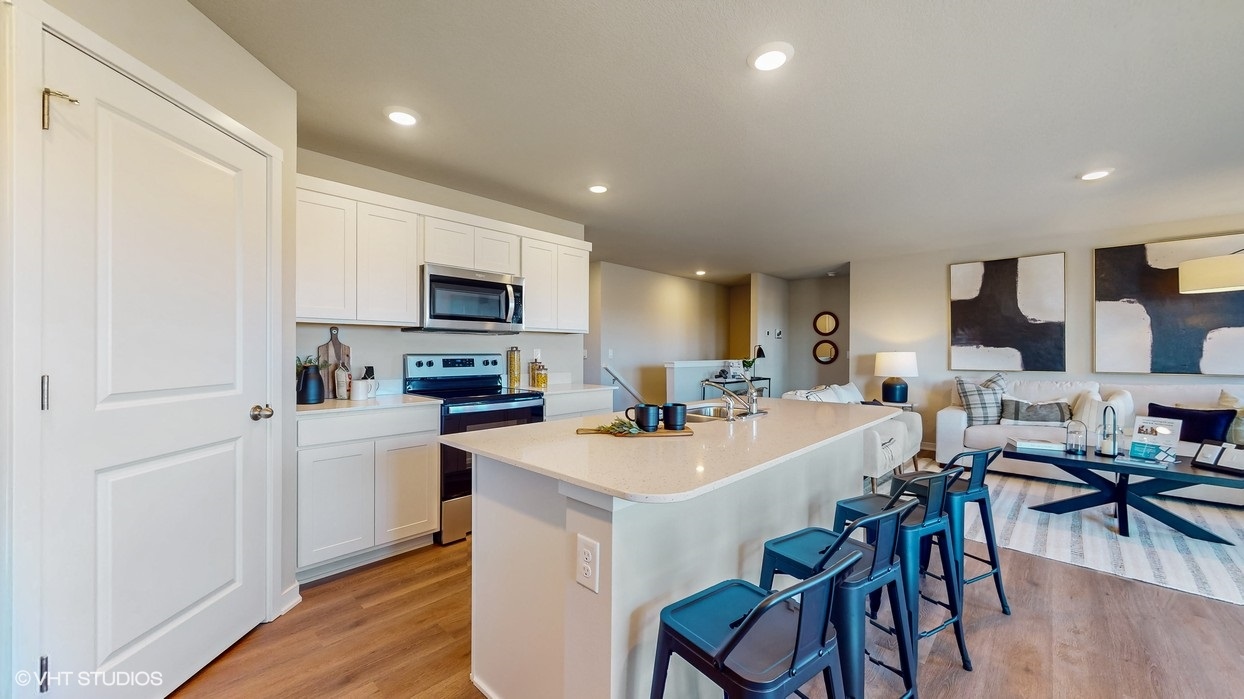 Kitchen with white cabinetry and quartz countertop