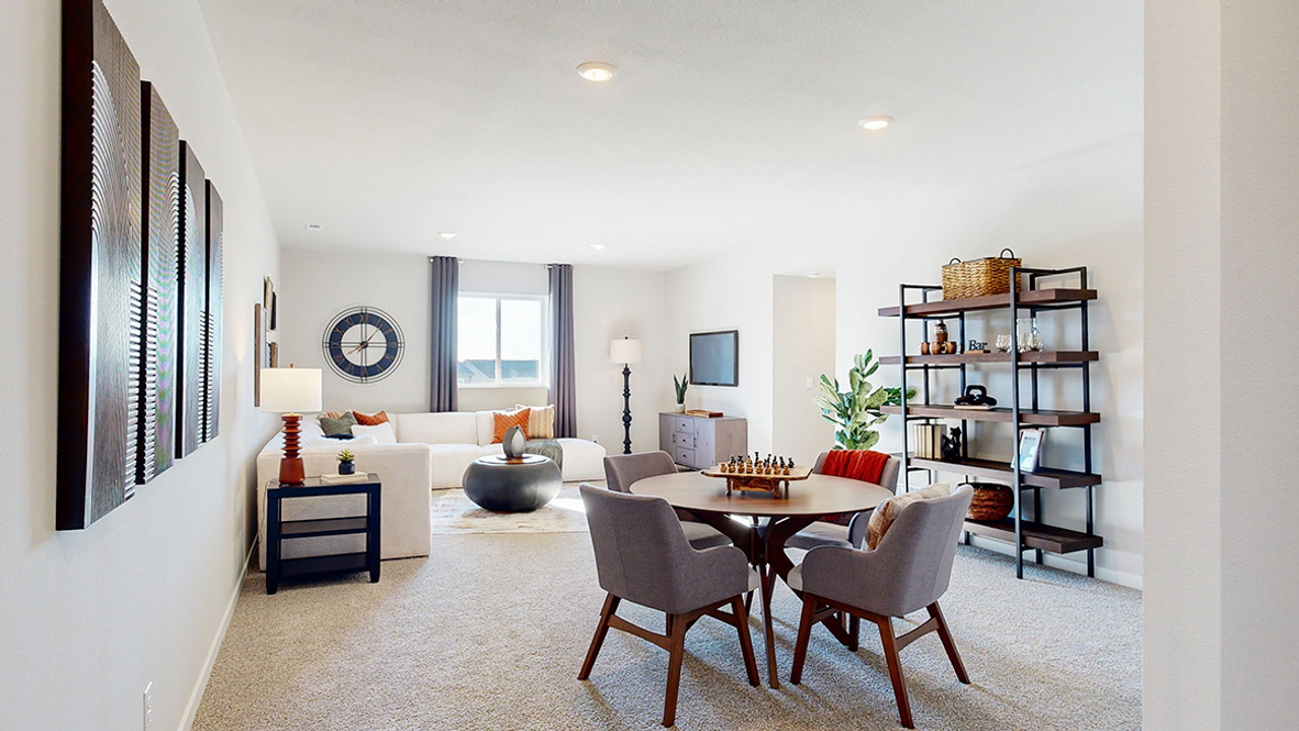 Finished basement living area with comfortable seating space and flexible room for entertaining or relaxing.