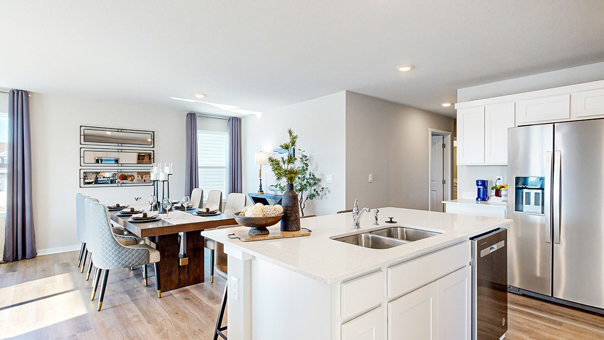 Kitchen with white cabinetry and quartz countertop