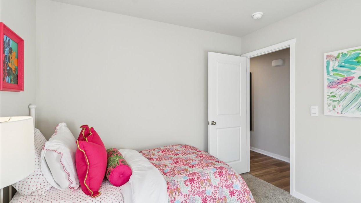 Comfortable secondary bedroom with natural light, modern finishes, and versatile living space.