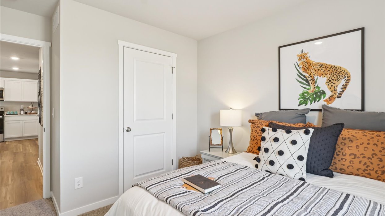 Comfortable secondary bedroom with natural light, modern finishes, and versatile living space.