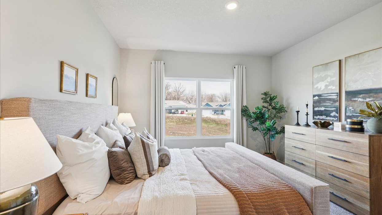 Primary bedroom with natural lighting and spacious layout