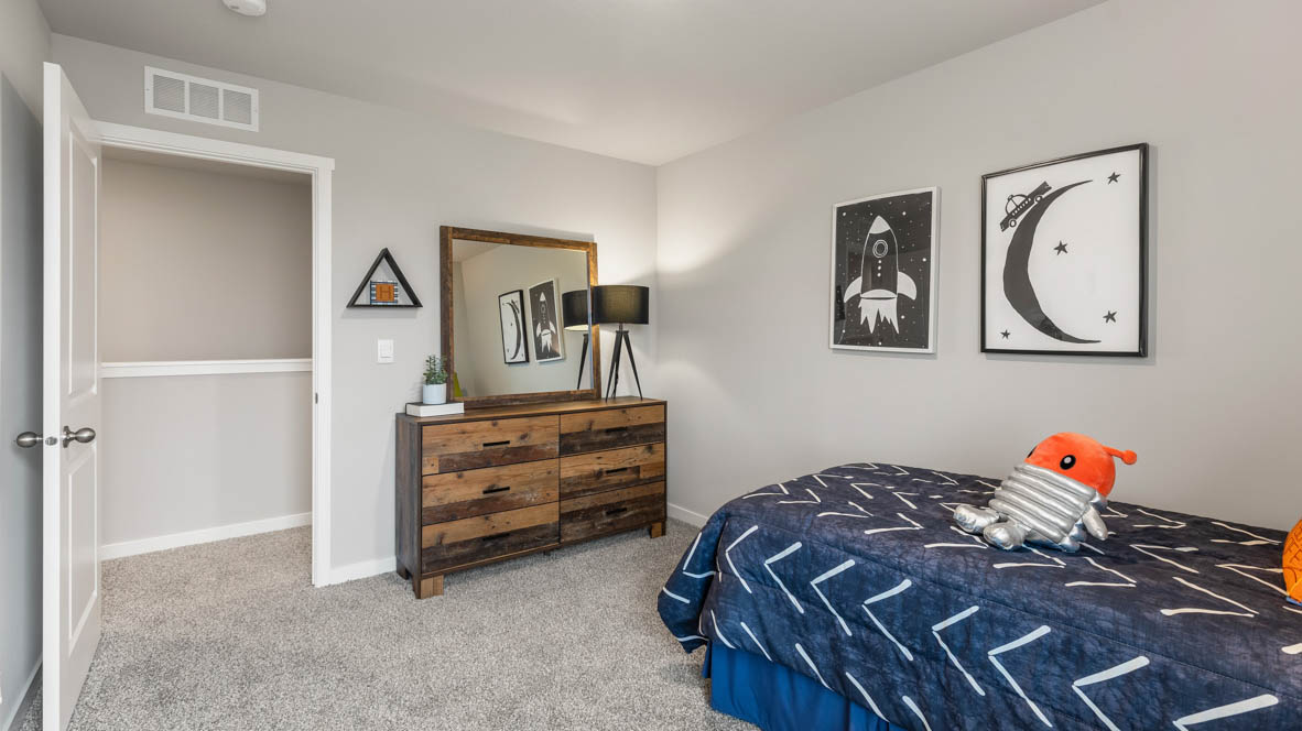 Comfortable secondary bedroom with natural light, modern finishes, and versatile living space.