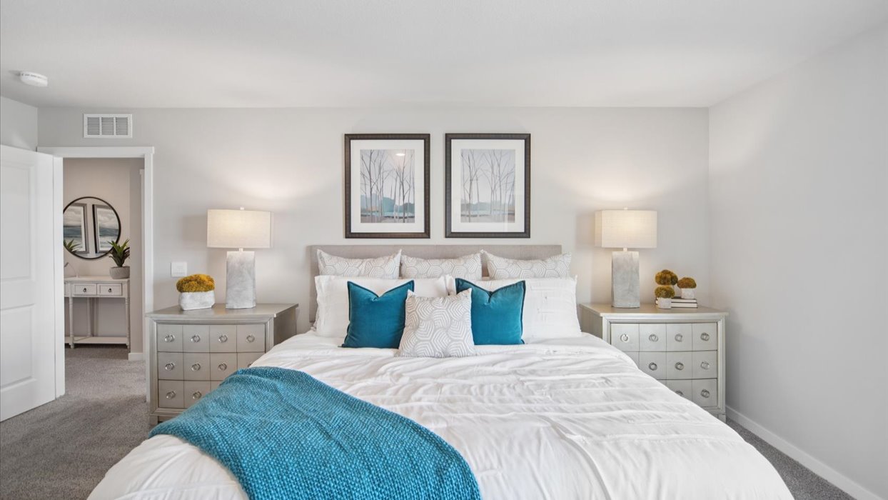 Primary bedroom with natural lighting and spacious layout