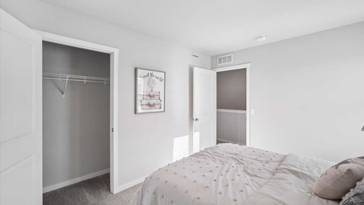 Comfortable secondary bedroom with natural light, modern finishes, and versatile living space.