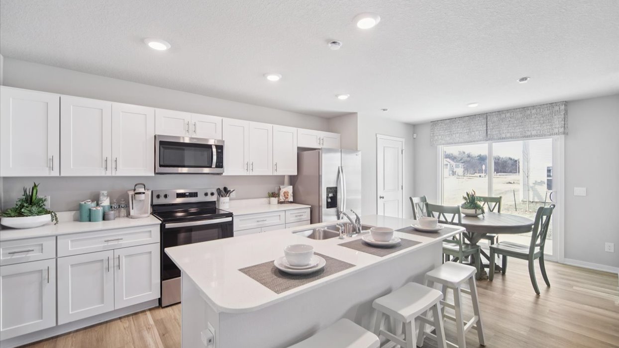 Kitchen with white cabinetry and quartz countertop