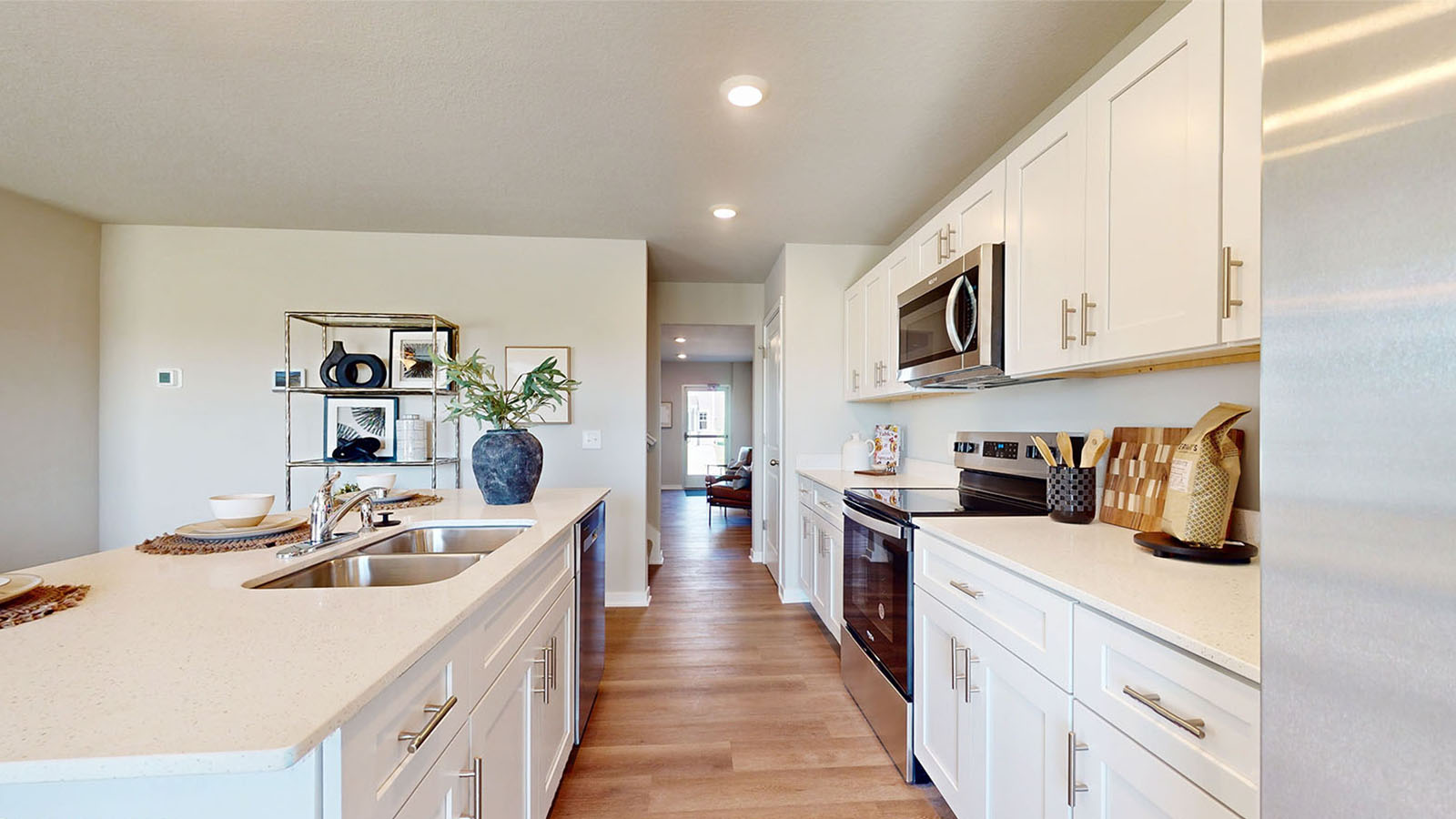 Kitchen with white cabinetry and quartz countertop