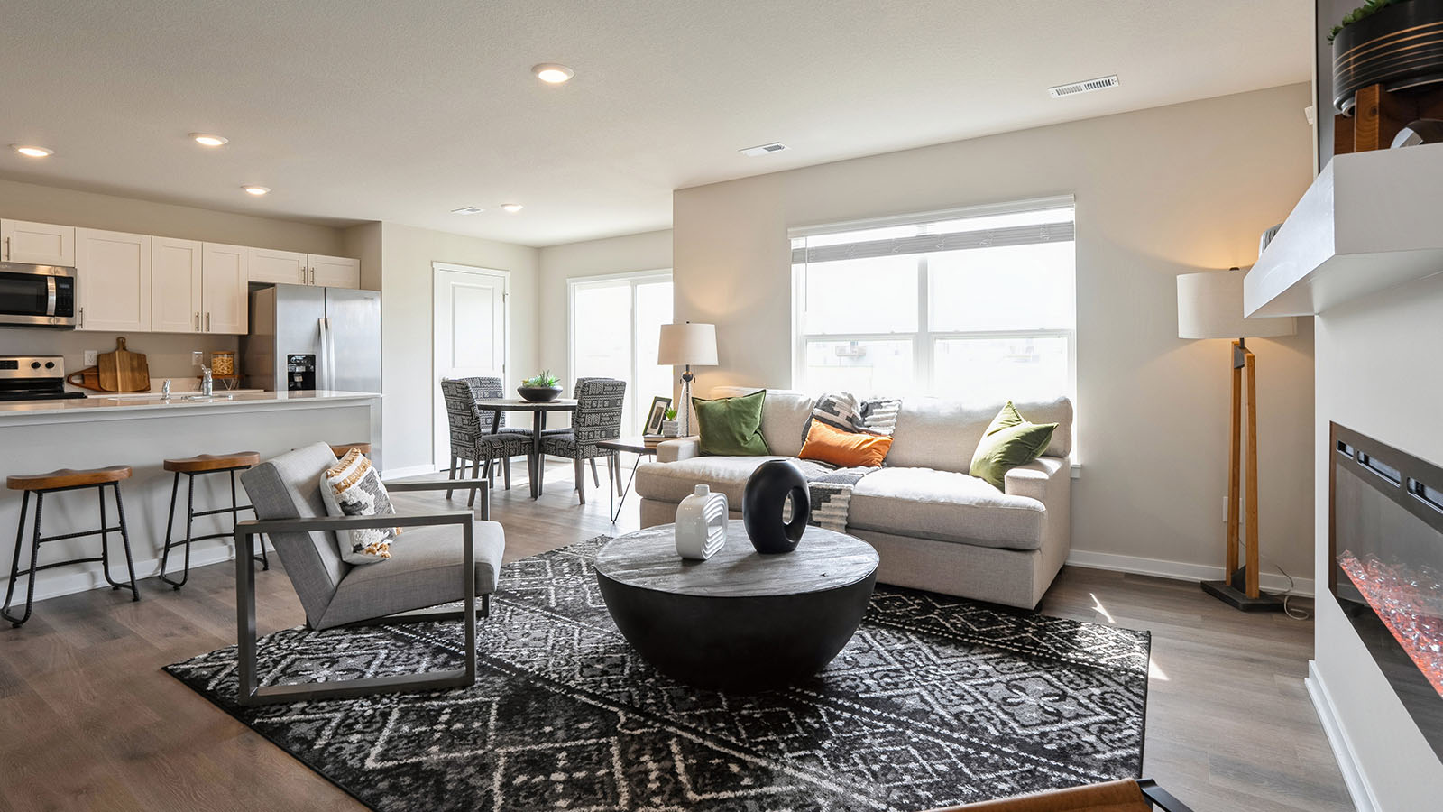 Open concept living room with electric fireplace