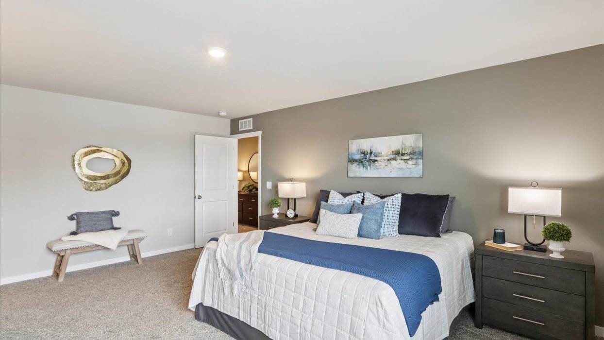 Primary bedroom with natural lighting and spacious layout