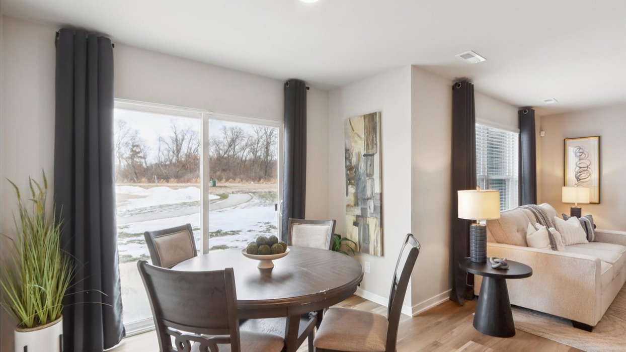 Open concept dining space with access to backyard