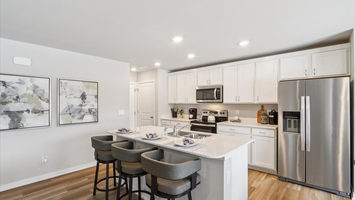 Kitchen with white cabinetry and quartz countertop
