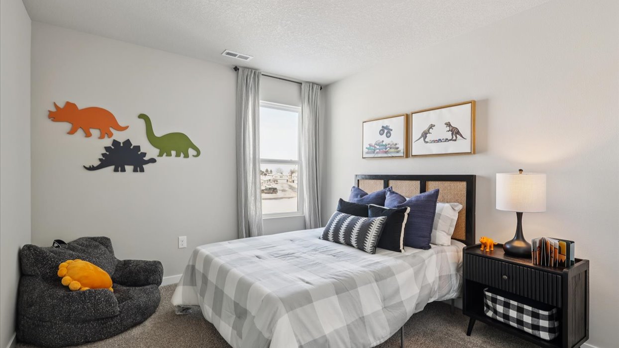 Comfortable secondary bedroom with natural light, modern finishes, and versatile living space.