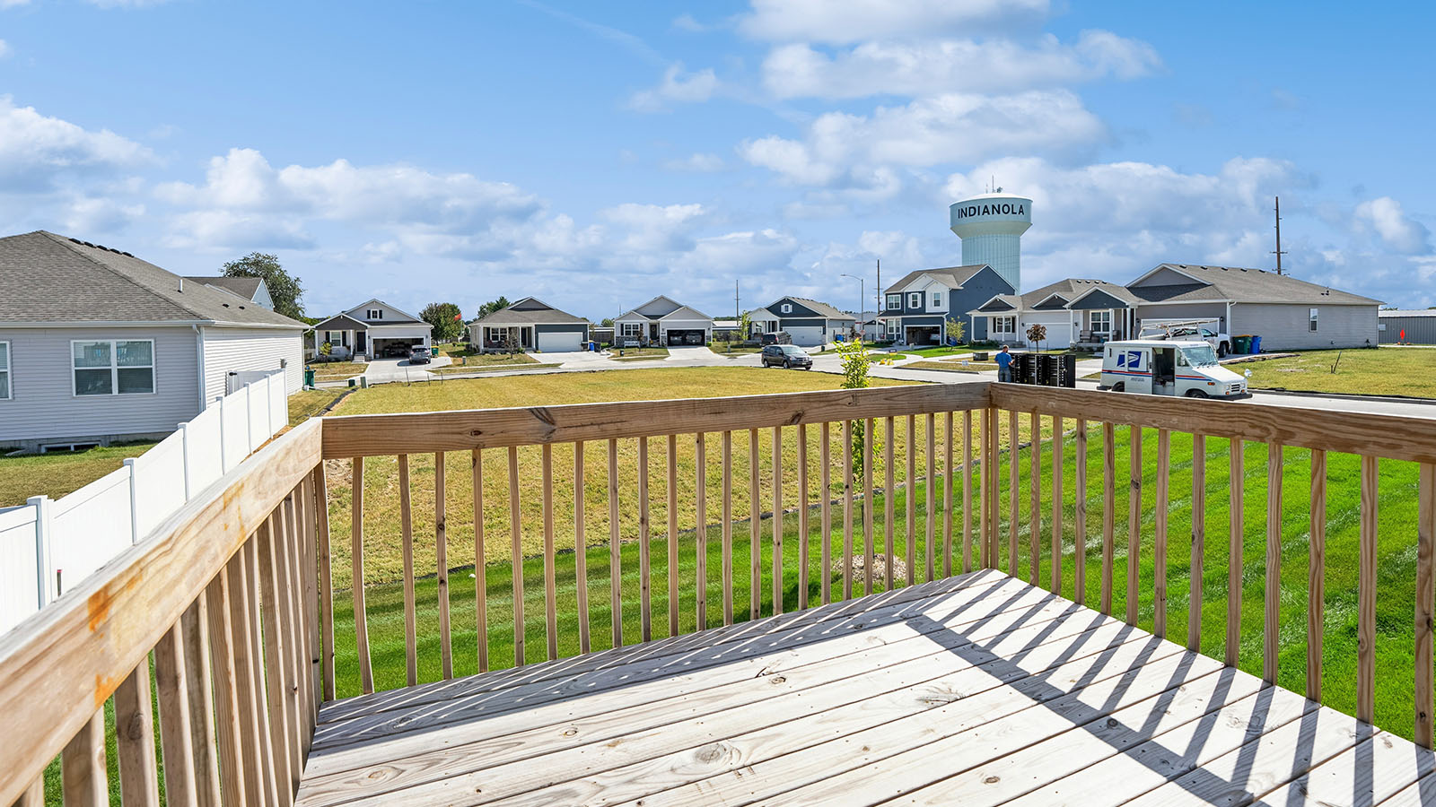Backyard with deck for grill setup, smooth indoor-outdoor transition, outdoor fun