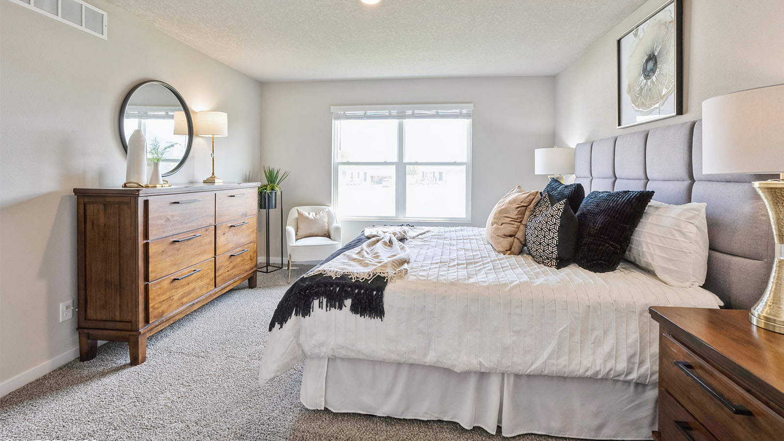 Primary bedroom designed with privacy and comfort, connecting to a spa-inspired ensuite and organized walk-in closet