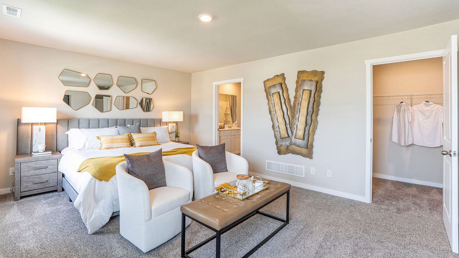 Spacious primary suite with natural light, attached bathroom, & walk in closet