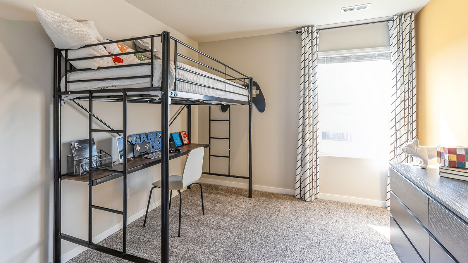 Comfortable secondary bedroom with natural light, modern finishes, and versatile living space.