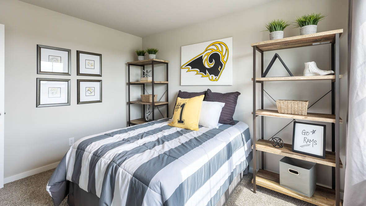 Comfortable secondary bedroom with natural light, modern finishes, and versatile living space.