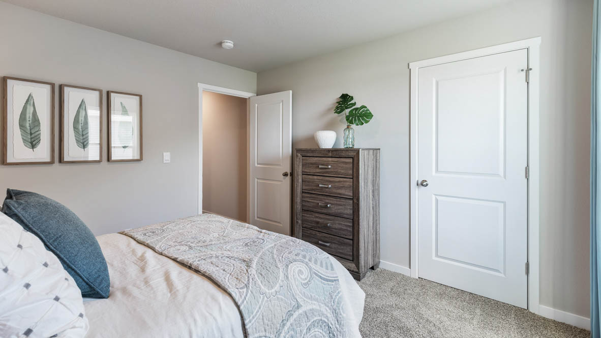 Comfortable secondary bedroom with natural light, modern finishes, and versatile living space.