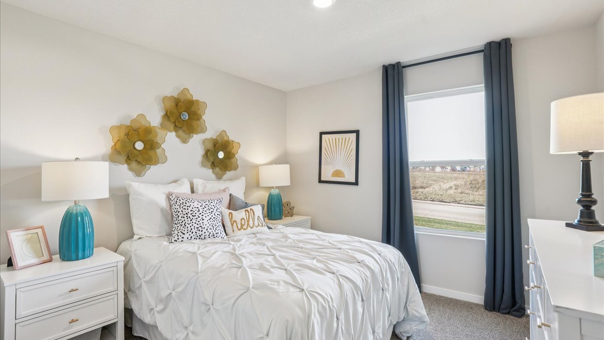 Comfortable secondary bedroom with natural light, modern finishes, and versatile living space.