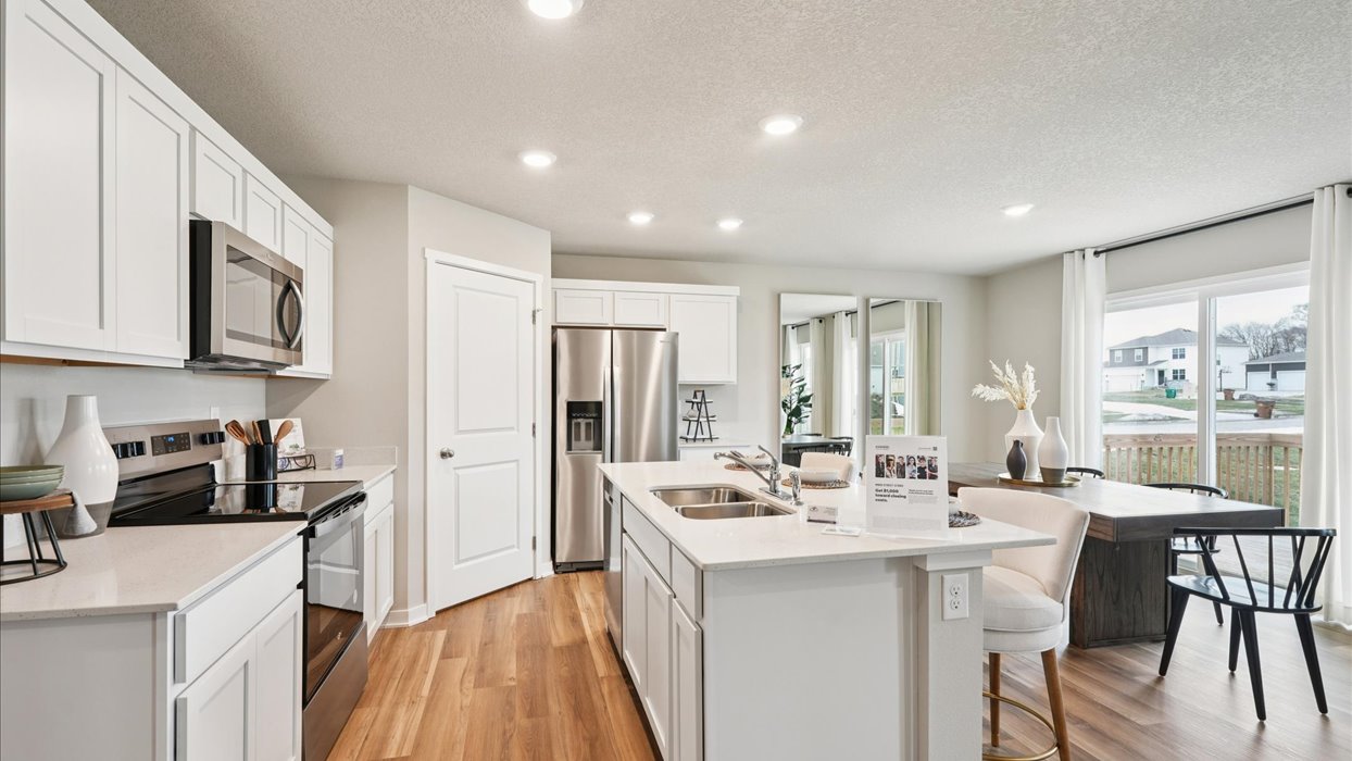 Kitchen with white cabinetry and quartz countertop